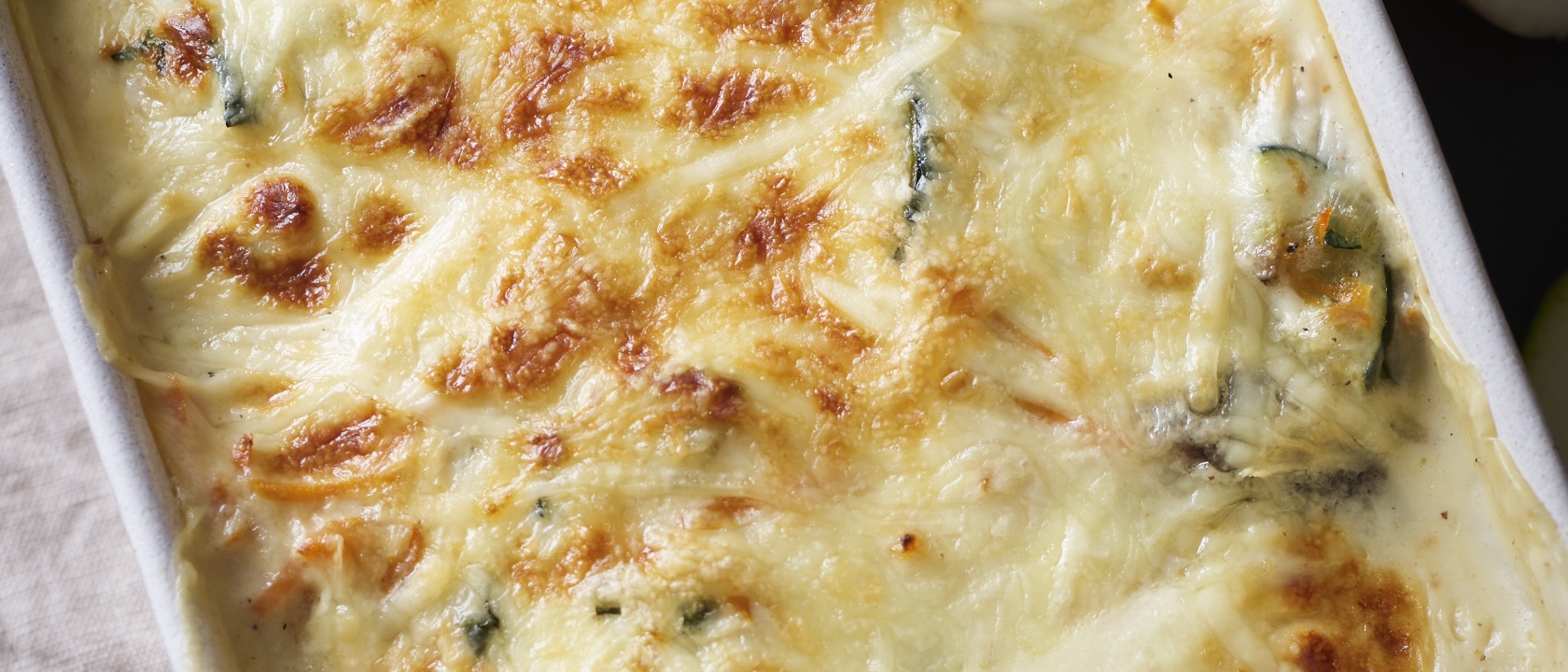 Pescada gratinada com legumes